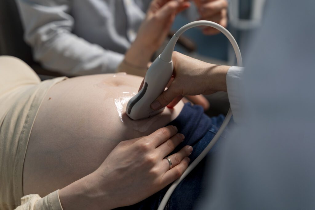 gynecologist performing ultrasound consultation